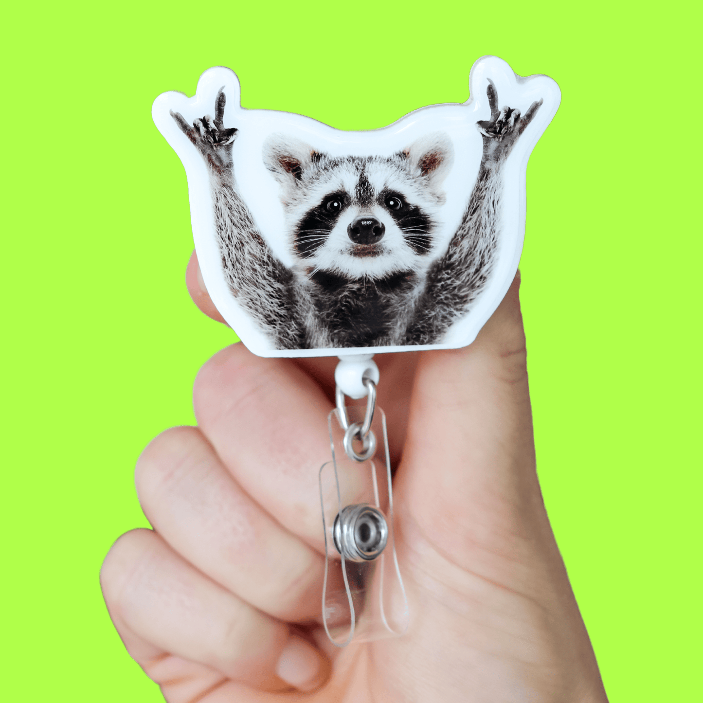 Badge Reel - Raccoon Hands Up - Acclaim Status CoAcclaim Status CoAlligator Clip