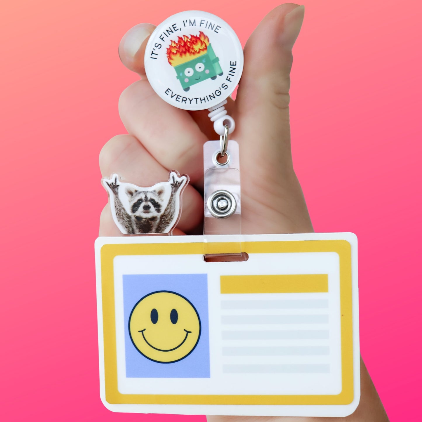 Cute raccoon badge topper on ID badge clip