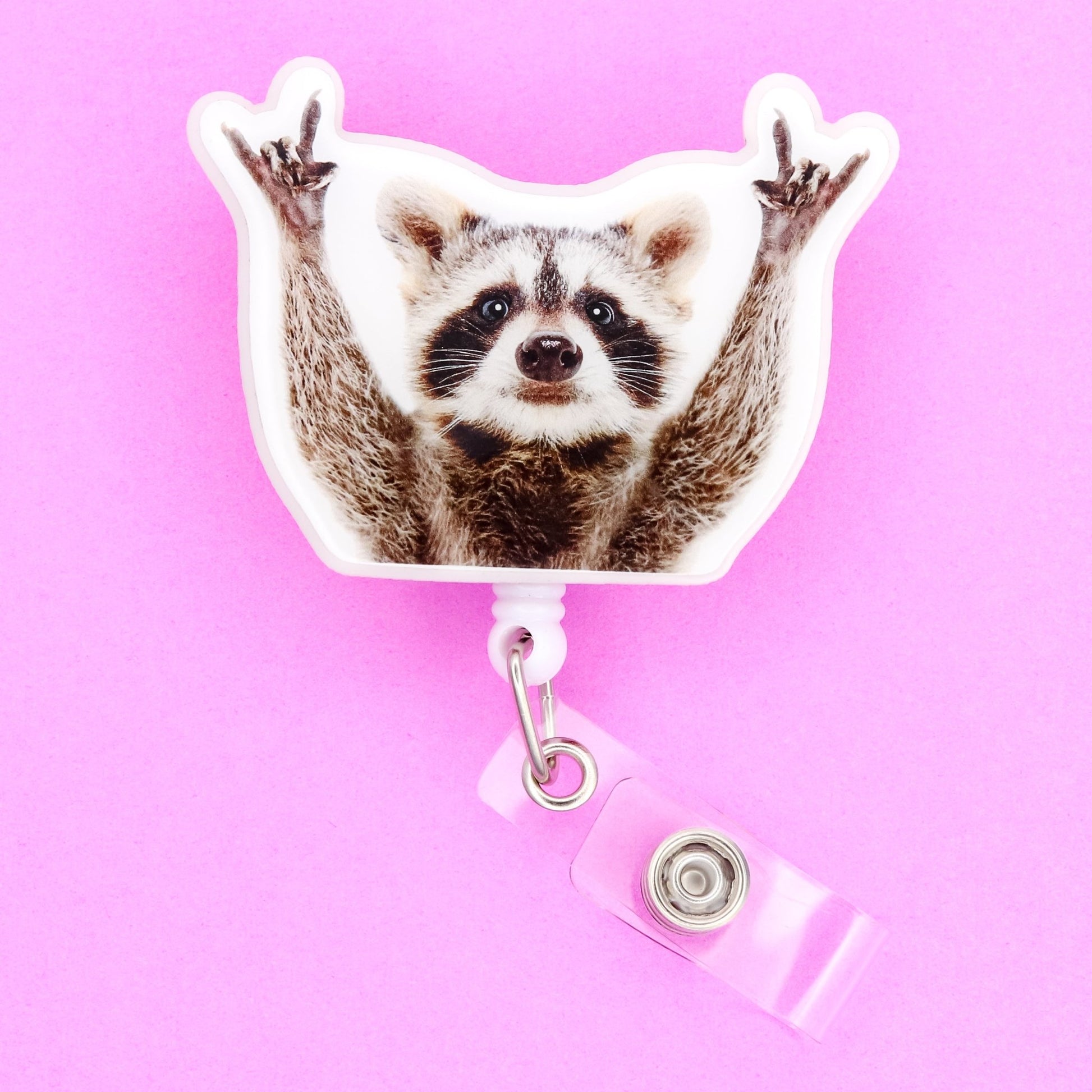 Badge Reel - Raccoon Hands Up - Acclaim Status CoAcclaim Status CoAlligator Clip